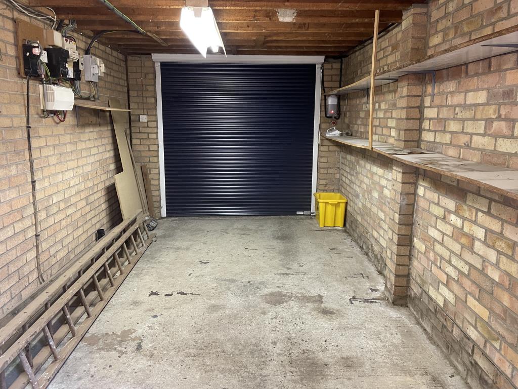 Lot: 99 - DETACHED BUNGALOW WITH CONSERVATORY FOR IMPROVEMENT - Internal view of garage from rear